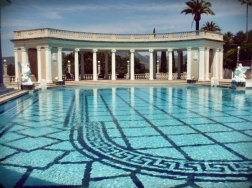 The second version of the pool, a substantial enlargement, was created in 1926-1927. This version had a series of concrete steps at the southern side called the Cascade, down which water flowed. The Neptune and Nereid statues, presently in the temple pediment, then stood at the top of the Cascade. The dressing rooms were begun in 1928 and furnished according to Hearst’s instruction. (hearstcastle.org)